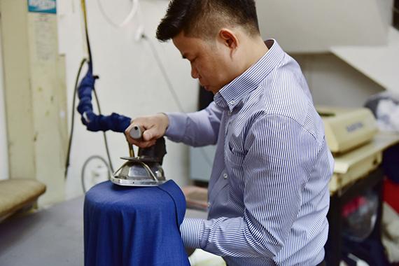 Discuss how to clean and ironing a Bespoke suit